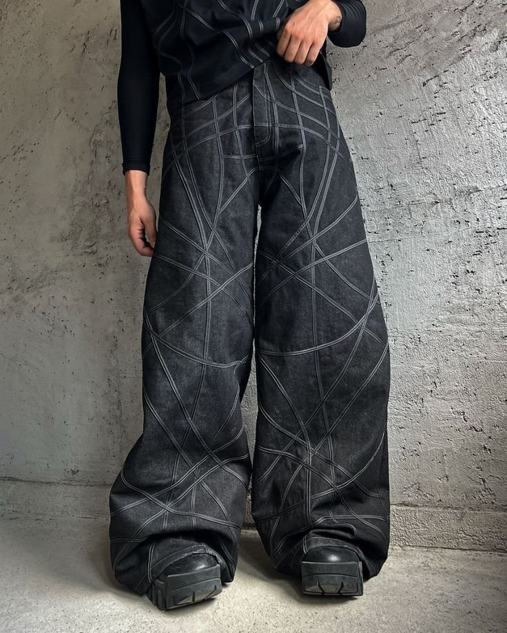 blue-blavk denim containing grey and white paint on it